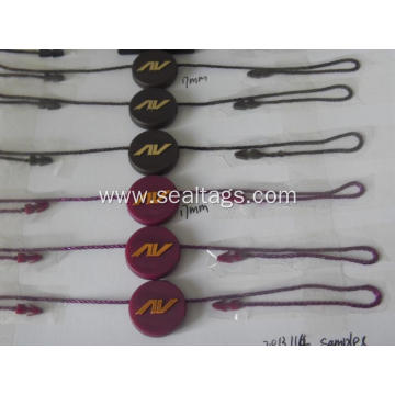 luggage labels with string and plastic bead